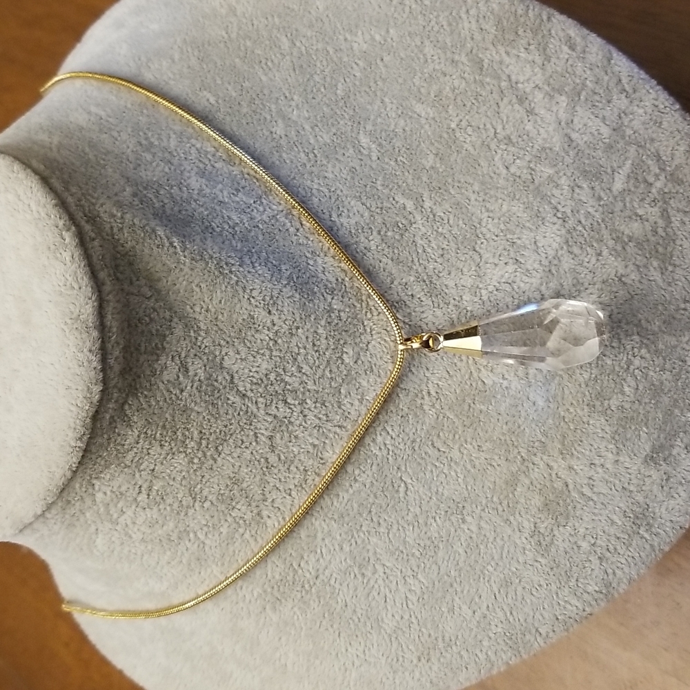 Long golden necklace with clear crystal prism pendant